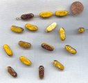 YELLOW BROWN GOLD DRIZZLE 19x8mm. CUT OVAL BEADS - Lots of 12
